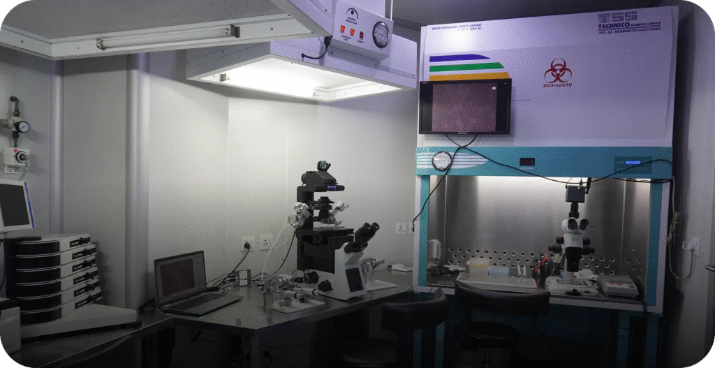 Wide view of the advanced embryology laboratory with micromanipulation microscope and sterile laminar flow workstations. - AAS Fertility